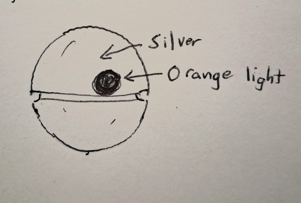 While watching a passenger jet through binoculars a spherical object came into view in the Eastern sky.