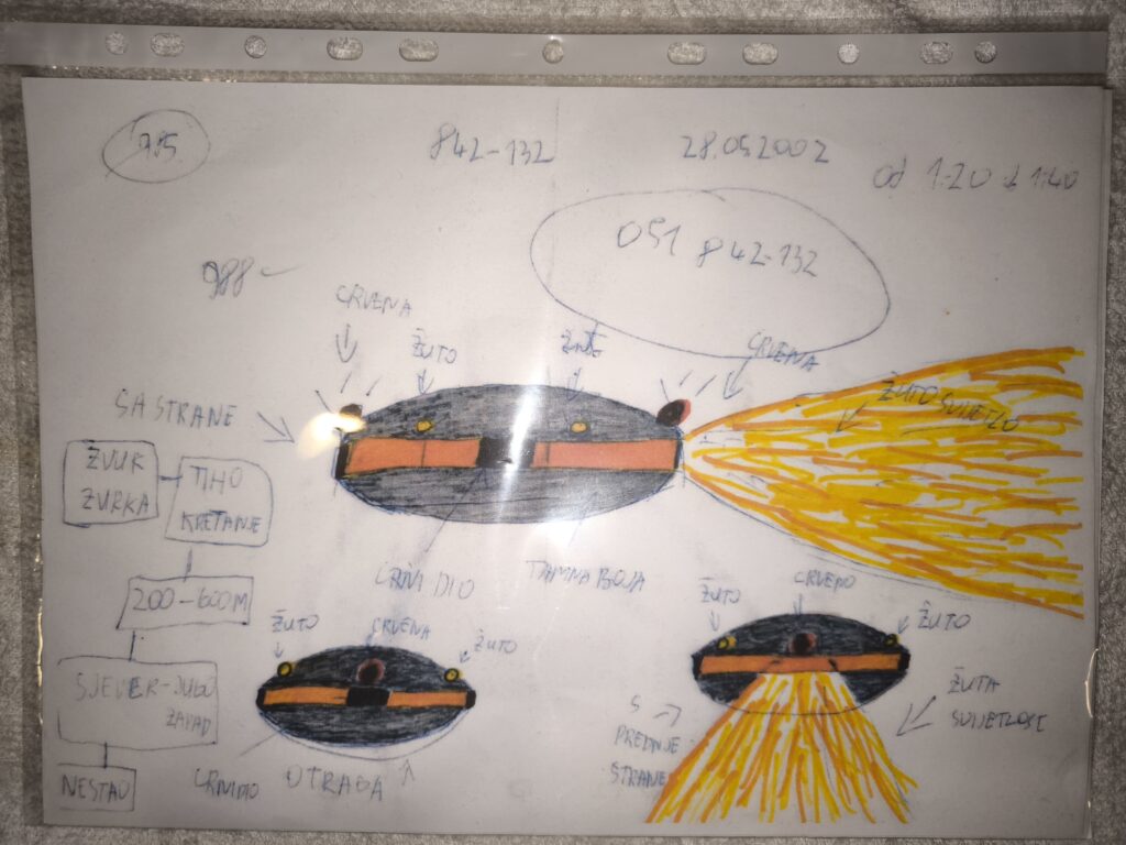 It was saucer-shaped, dark, with a metallic gray-blue color, and a faint glow coming from its sides